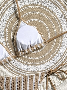 Close-up of crochet texture bikini top with removable pads and bohemian fringe details