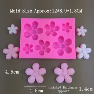 Pink silicone mold featuring various flower shapes for resin crafts and cake decoration