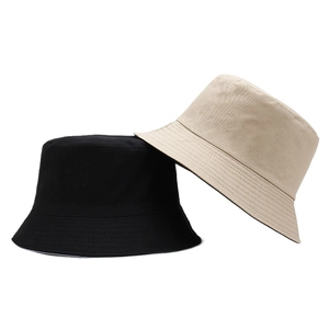 Minimalist cotton bucket hats in black and beige with stitched brim for outdoor wear