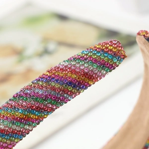 Rainbow rhinestone headband with colorful crystals in a wide padded velvet design