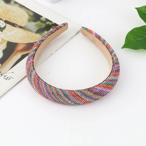 Close-up of rainbow rhinestone padded headband with colorful crystals and soft sponge base
