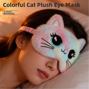 Close-up of a colorful plush cat sleep mask with embroidery and soft elastic headband