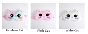 Detailed view of colorful, pink and white plush cat sleep masks with embroidery