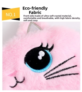 Detail of pink crystal ultra-soft plush fabric with cute cat embroidery and blue eyes