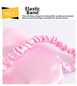 Close-up of flexible elastic strap on pink satin sleep mask with soft plush edges