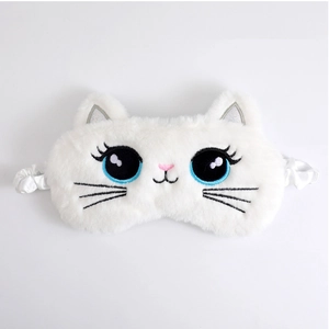 Detail of white plush cat sleep mask showing soft texture and cute embroidered cat face