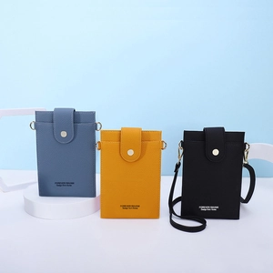 Vertical crossbody phone bags in blue, yellow, and black with textured finish