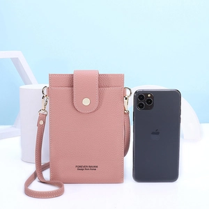 Pink lychee texture crossbody phone bag with snap closure and adjustable strap