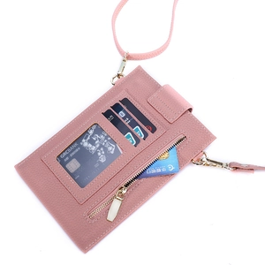 Detail of pink litchi pattern phone bag with card slots and a clear ID window