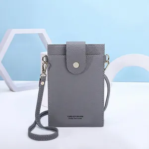 Dark grey pebble leather crossbody phone bag for women with thin shoulder strap