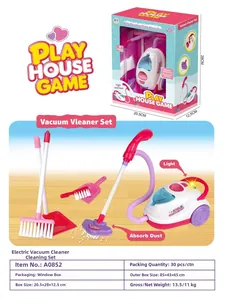 Detailed view of pink toy vacuum cleaner set including broom and brush for kids