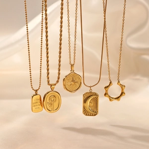 Golden 18K plated stainless steel necklace set with star and sun relief pendants