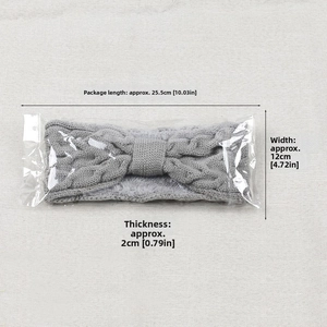 Gray cable knit headband with fleece lining and product dimensions shown in a package
