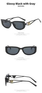 Close-up of shiny black sunglasses with gold triangle detail on the temple arms