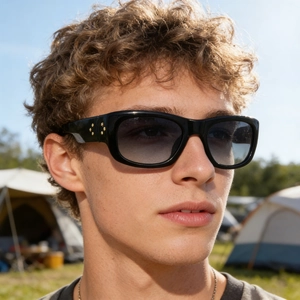 Outdoor shot of men wearing black polarized sunglasses with golden star metal rivets