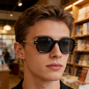 Close-up of square polarized sunglasses with black frames and gold metal temples
