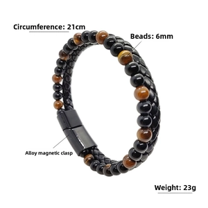 Detail view of tiger eye beads and braided leather bracelet with magnetic alloy clasp
