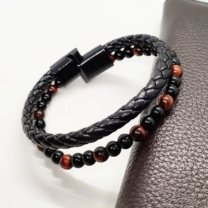 Close-up of men's double-layer leather rope bracelet with tiger eye beads and magnetic clasp