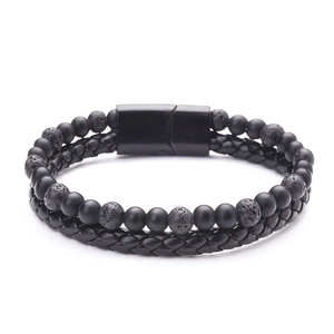 Detail of black lava stone beads and braided leather cord with matte magnetic clasp