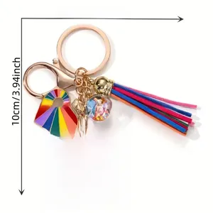 Detailed view of rainbow heart tassel keychain with be kind acrylic plate and sizing info