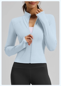 Close-up of sports jacket sleeve featuring functional thumbhole and precision stitching