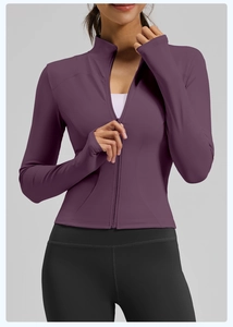 Close-up of slim-fit yoga jacket with stand collar and thumbhole sleeves in purple