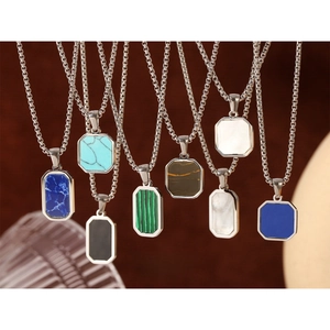 Detail view of octagon natural stone pendants on silver tone stainless steel chains
