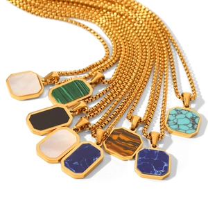 Detailed flat lay of octagonal natural stone pendants with golden box chains in multi colors