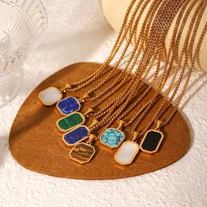 Golden stainless steel octagon necklaces with natural stone pendants on brown velvet