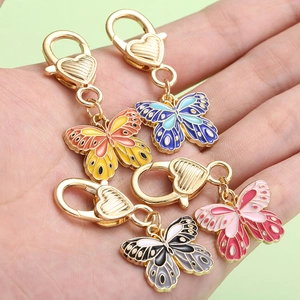 Detail of colorful butterfly keychains with heart-shaped lobster clasps in four colors