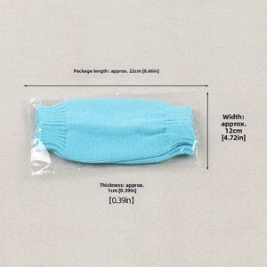 Sky blue knitted gloves in packaging with measurements of 22cm length and 12cm width