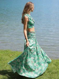 Two-piece tropical palm leaf print set with sleeveless crop top and high-waisted maxi skirt
