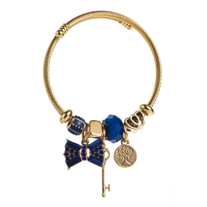 Detail view of gold twisted wire bracelet with navy blue crystal bow and charms