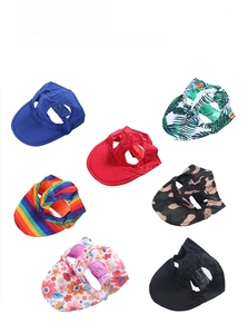 Detail view of 7 patterns for pet baseball caps with ear holes in various colorful prints