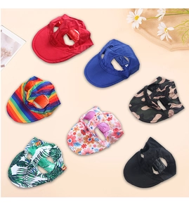 Detail of dog baseball caps in various colors with ear holes for pet sun protection