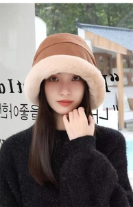 Close-up of thick plush faux fur brim and two-tone winter bucket hat texture