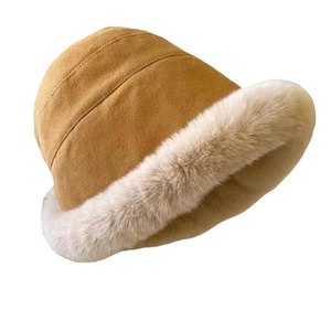 Caramel and beige winter bucket hat with thick faux fur trim and warm plush lining