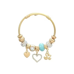 Golden cable bracelet with swan charms, blue bead and Thank You heart pendant