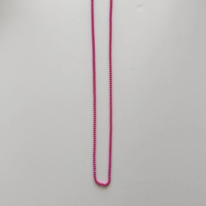 Detailed view of the vibrant rose red thin metal square link chain for gummy bear necklace