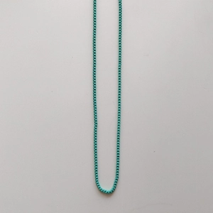 Detail view of turquoise box chain necklace with high quality metallic lacquer finish