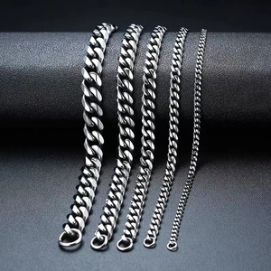 Silver stainless steel Cuban link chains for men in five different widths on black leather