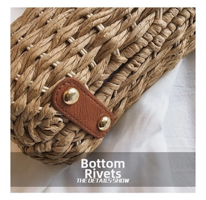 Detail view of woven straw bag bottom with brown leather patch and gold metal rivets