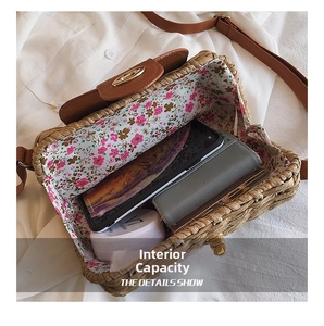 Internal view of a woven straw bag showing space for phone, wallet and cosmetics