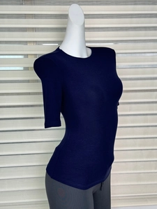 Macro shot of navy blue slim fit t-shirt fabric texture and fine stitching details