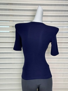 Detailed view of navy blue slim-fit T-shirt with structured padded shoulders and round neck