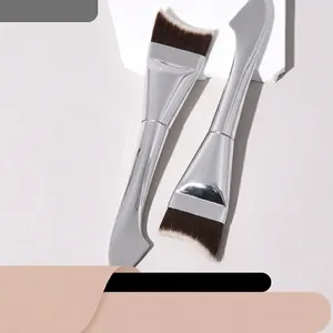 Macro detail of dual-ended makeup brush with crescent bristles and flat metal spatula
