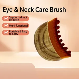 Close-up of ergonomic wooden handle and dense crescent-shaped fiber bristles of the brush