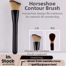 Macro detail of horseshoe shaped contour brush with brown bristles and black handle
