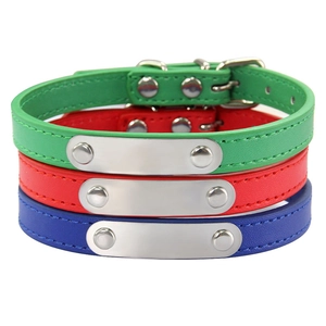 Three-color leather dog collars with engravable metal ID tags in red, blue, and green