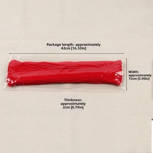 Close-up showing a red knitted leg warmer in flat packaging with dimensions 42cm by 15cm